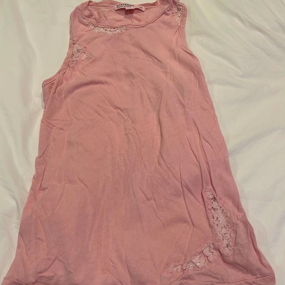 Adorable, muted light pink tank w lace detail.